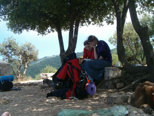 Two dati girls who were hiking the whole Israel trail - praying after eating.