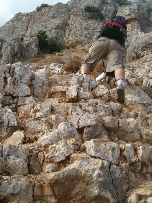 Don climbing up Arbel Cliff