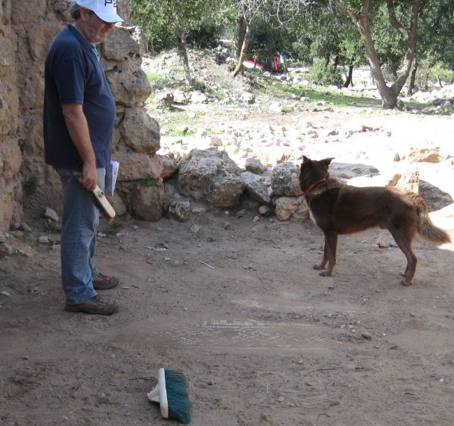 Don brushing the sand off the mosaics at Hanot.