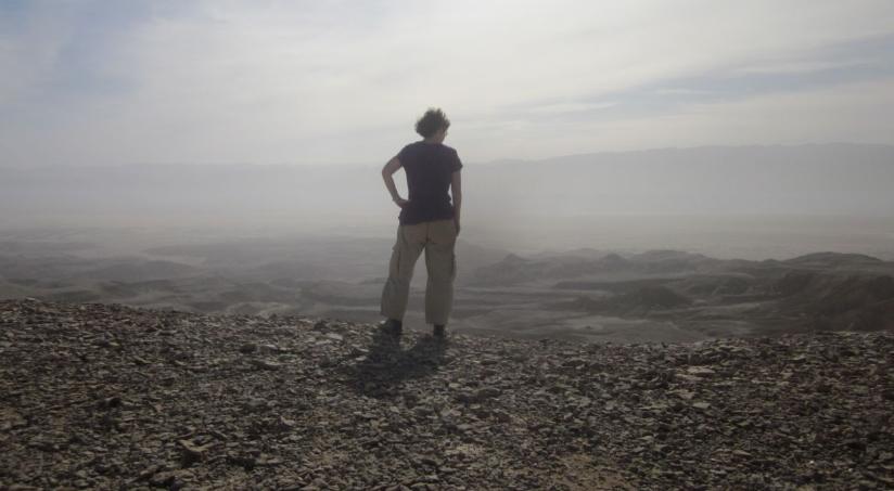 Diana silhouetted on the edge of the Shacharut cliffs