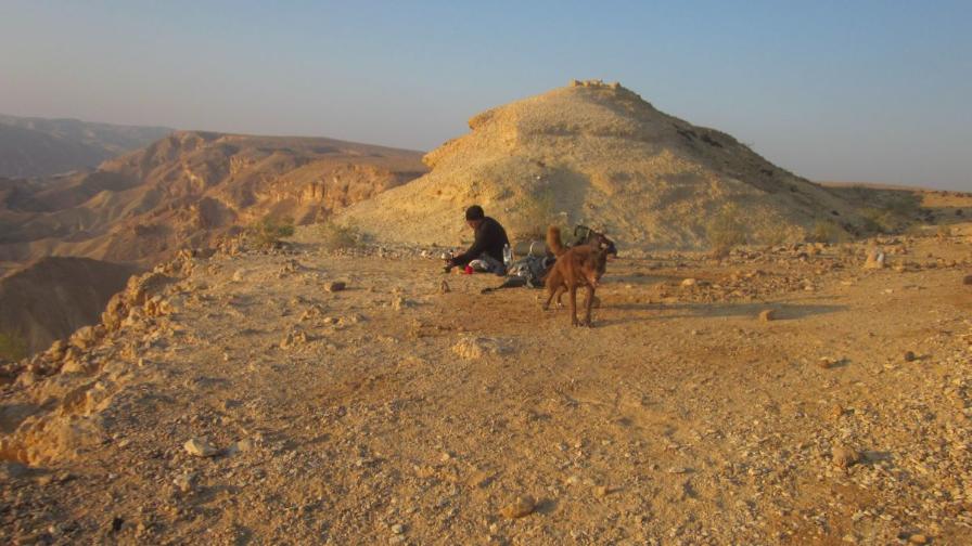 Don and Taffy eating breakfast with a view of Jordan past the Arava