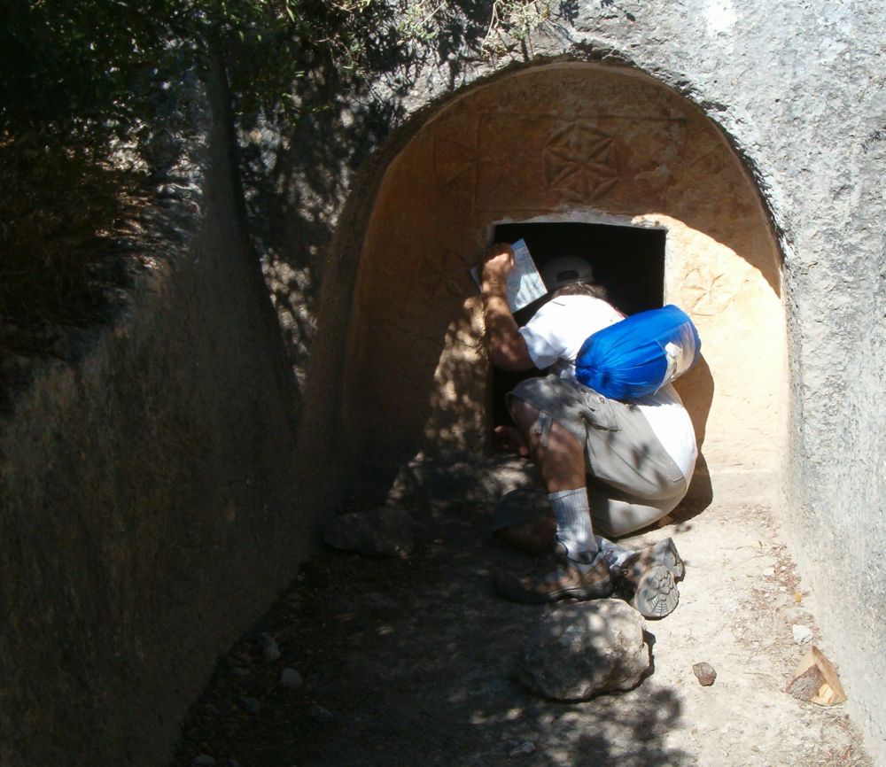 Don looking into a burial cave.