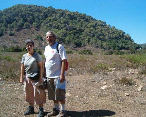 Lone girl hiker takes our picture in a gentle area in the middle of the Carmel mountains.