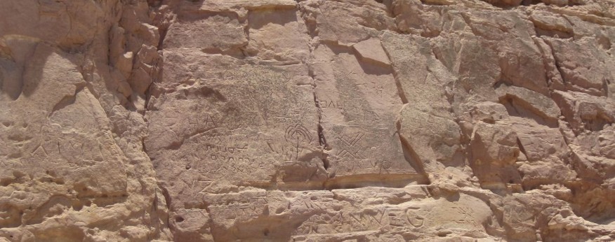 Teen ages carve their names in the cliffs in the bottom of the crater during school trips