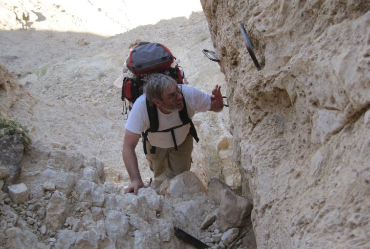 Don climbing up the last cliff