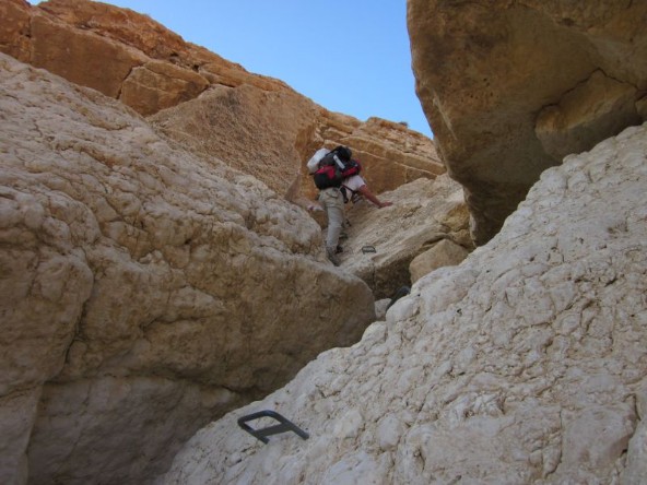 Don climbing rugged terrain