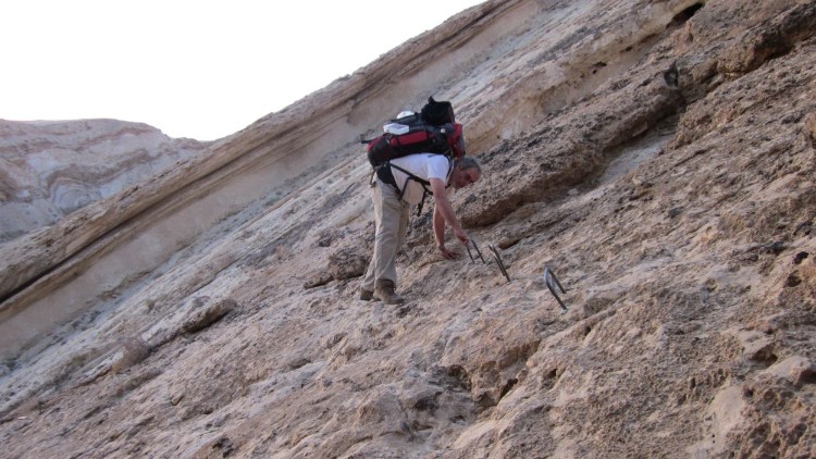 Don traversing steep slope