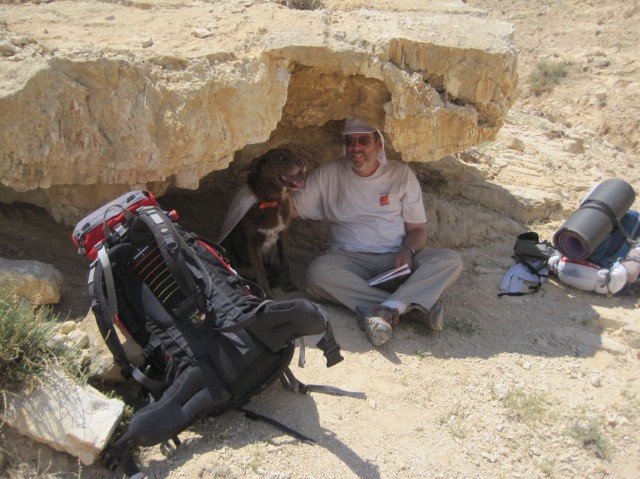 Don and Taffy resting under a rock in the shade