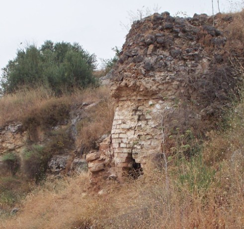 Building set into hill.  Don't know how old or what it was for.