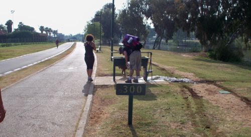 Yarkon Park in Tel Aviv, drinking fountain and joggers